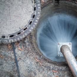 Water coming out of a sewer pipe.