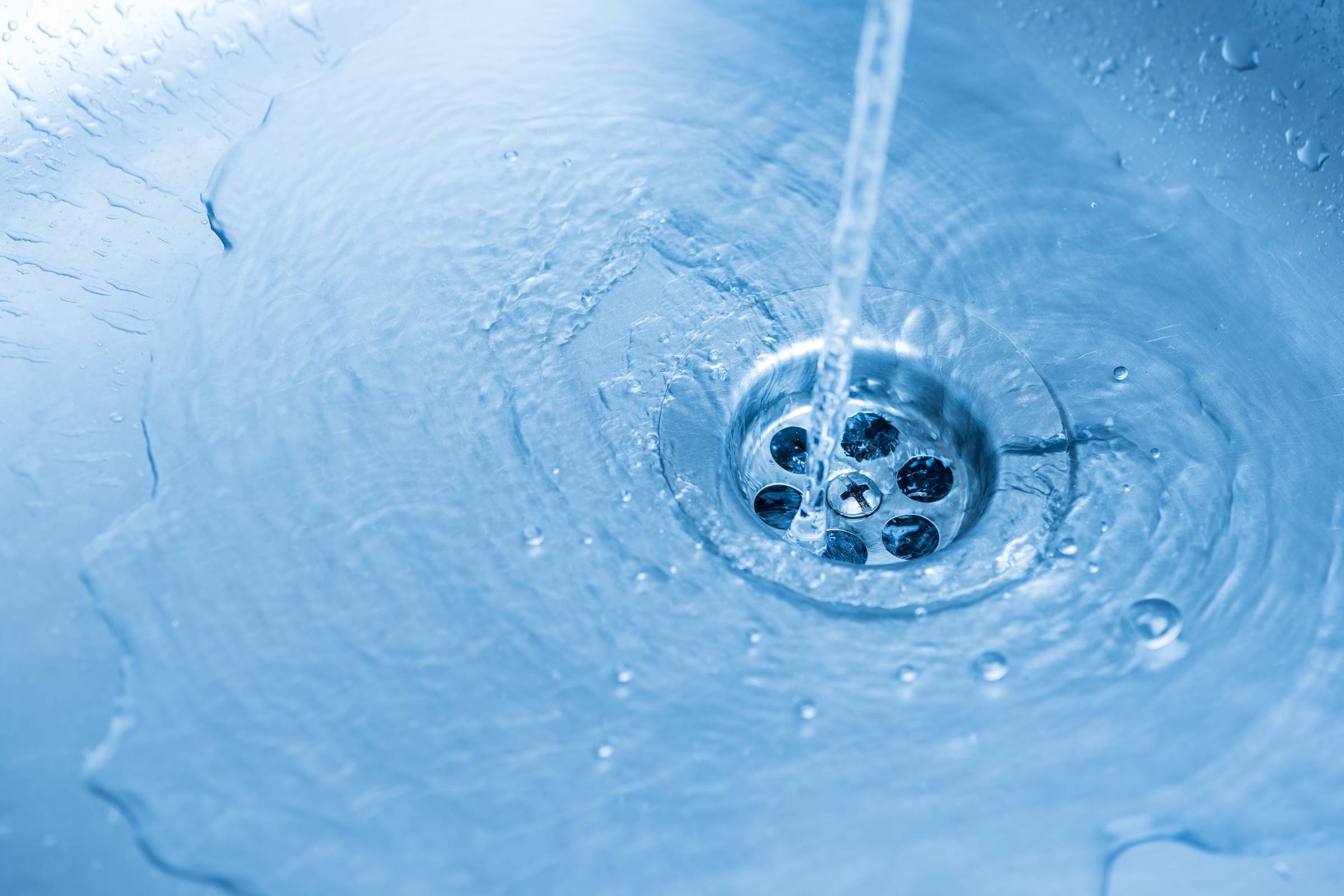 sink with flowing water in a home.