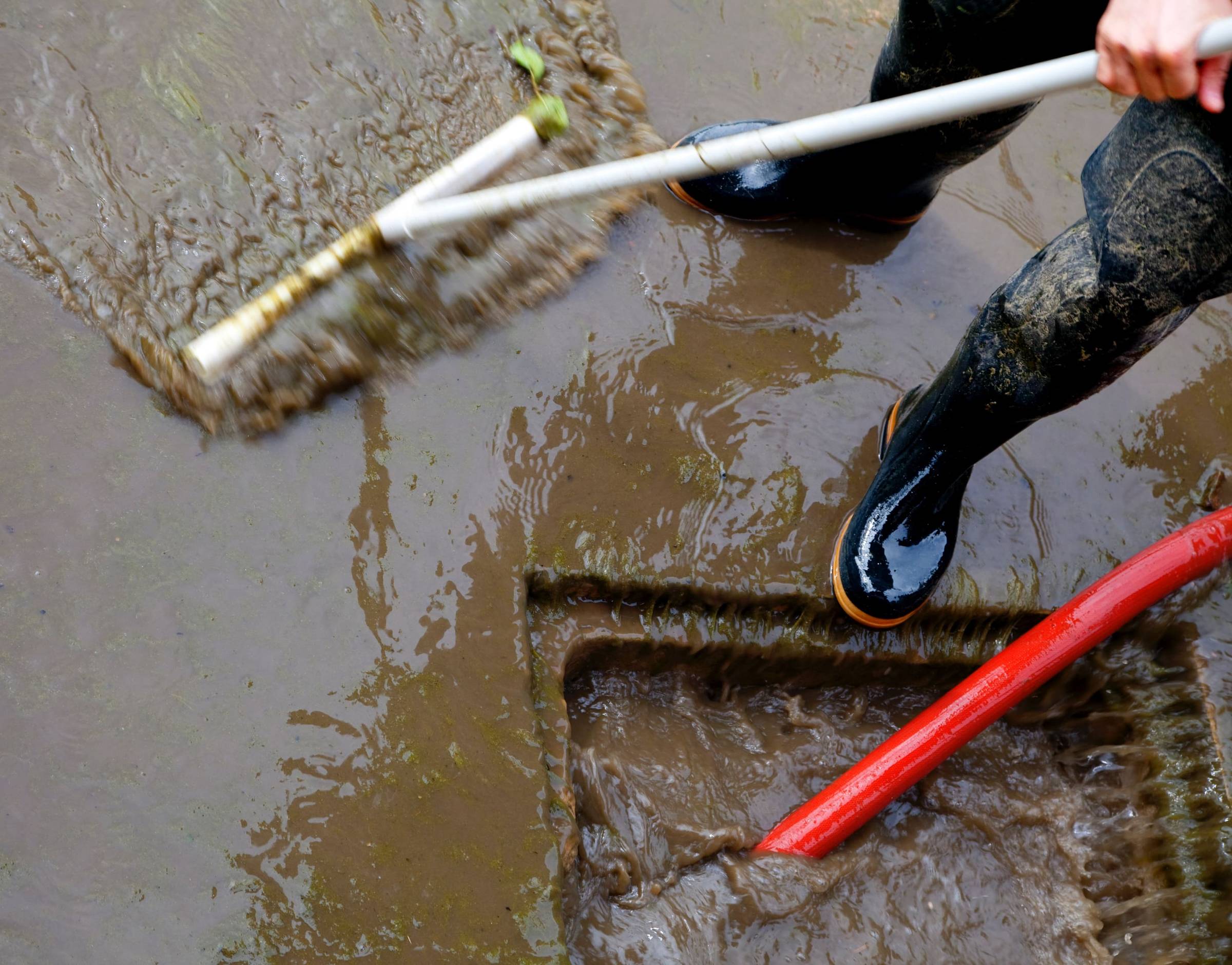 cleaning out a sewer blockage