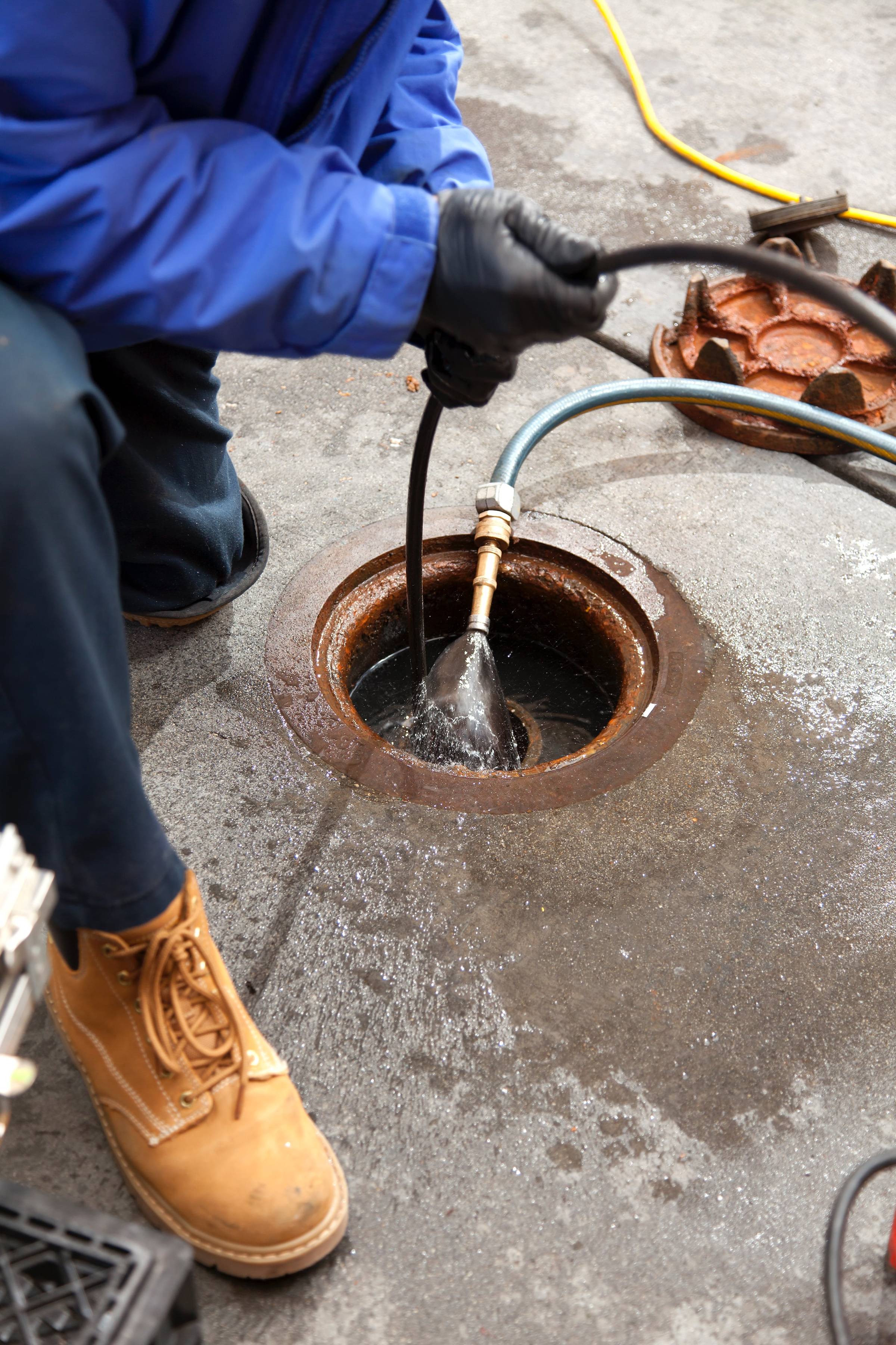 A water pipe with a hose coming out of it.